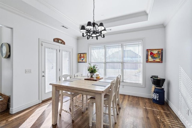 1303 NW Hermanus St, Bentonville, AR 72712 - dining room with wood finished floors, a raised ceiling, baseboards, a notable chandelier, and ornamental molding