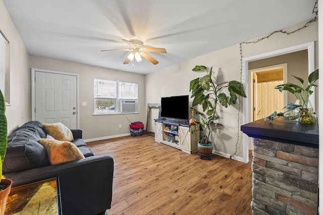 living room featuring light wood-type flooring and ceiling fan