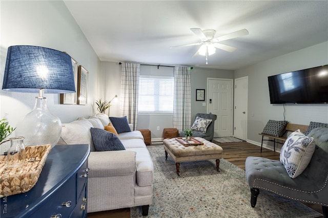 living room featuring dark hardwood / wood-style floors and ceiling fan