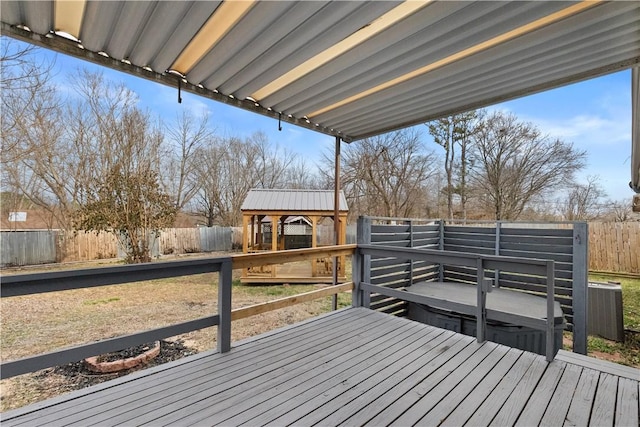 deck with a fenced backyard