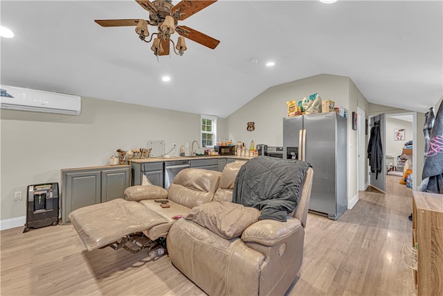 living room with lofted ceiling, ceiling fan, light wood-type flooring, and a wall unit AC