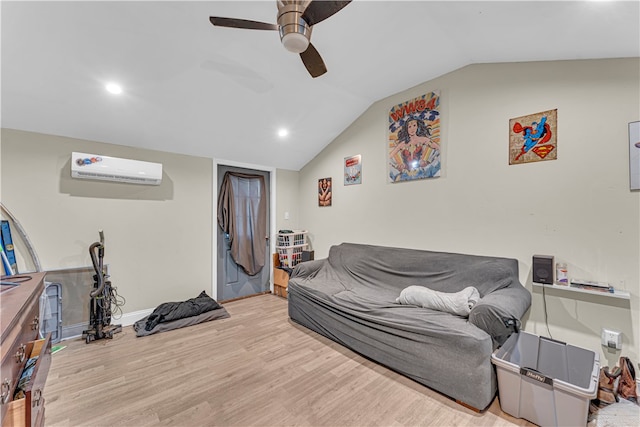 living room featuring lofted ceiling, ceiling fan, light hardwood / wood-style flooring, and a wall mounted air conditioner