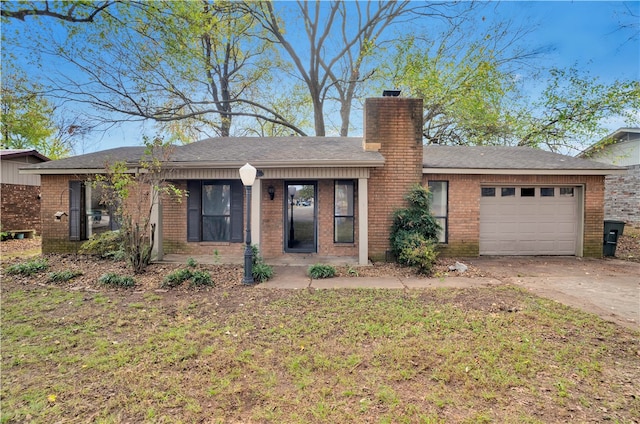 ranch-style home featuring a garage and a front yard