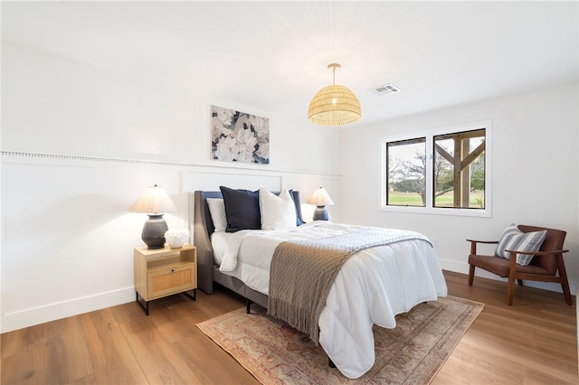 bedroom with wood-type flooring