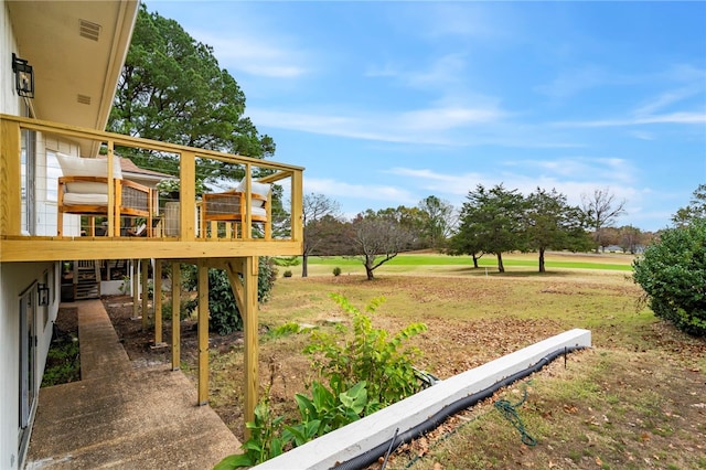 view of yard featuring a wooden deck