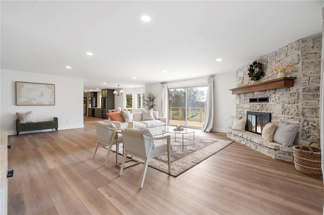 living room featuring a fireplace and light hardwood / wood-style flooring