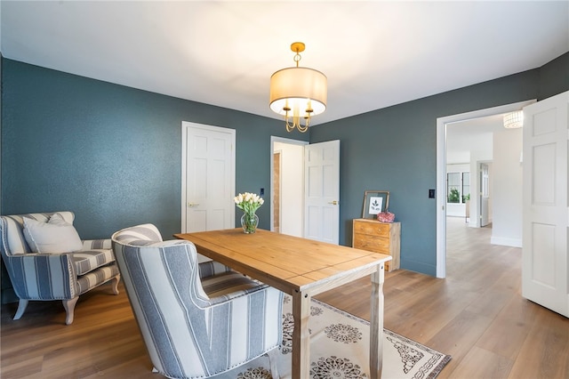 dining space with wood-type flooring