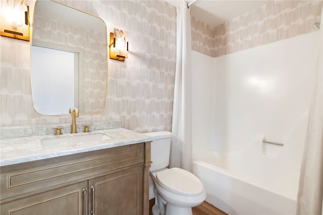 full bathroom featuring vanity, toilet, and shower / bathtub combination with curtain