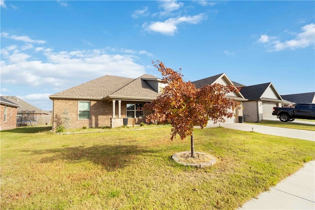 view of front of house with a garage and a front lawn