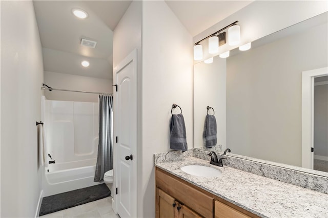 full bathroom featuring tile patterned floors, toilet, vaulted ceiling, vanity, and shower / bath combo with shower curtain