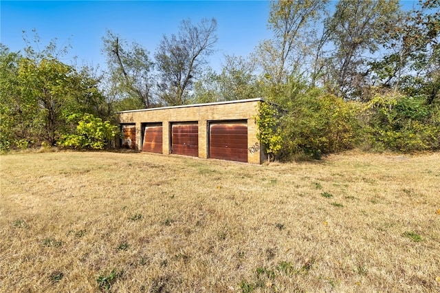 garage with a yard