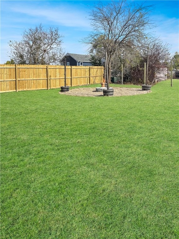 view of yard with a fire pit