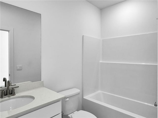 full bath with toilet, vanity, and  shower combination