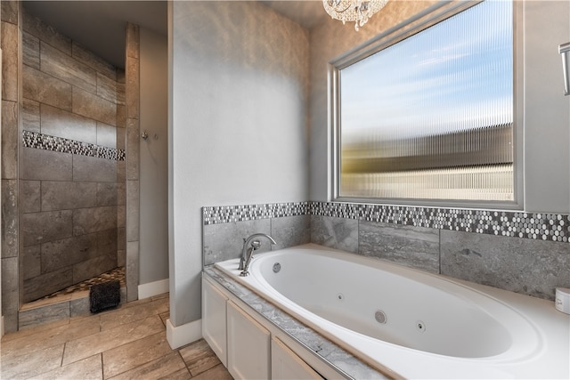 bathroom with separate shower and tub