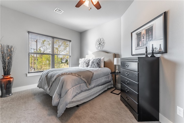 bedroom with light colored carpet and ceiling fan