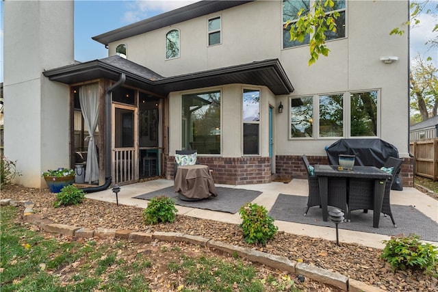 rear view of house featuring a patio