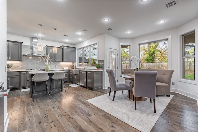 dining room featuring dark hardwood / wood-style flooring and sink