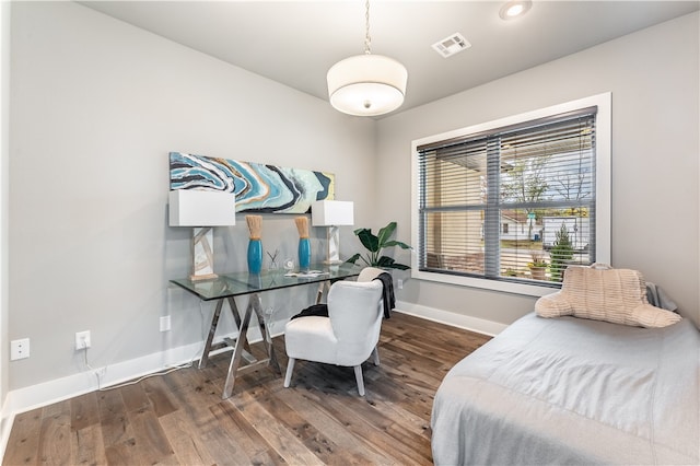 bedroom featuring dark hardwood / wood-style flooring