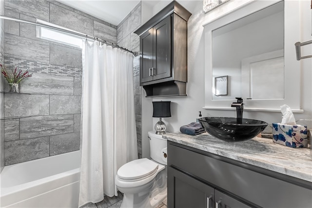 full bathroom with shower / bathtub combination with curtain, vanity, and toilet