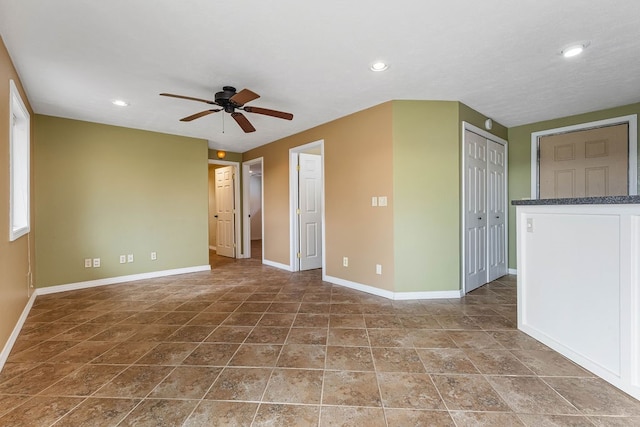 empty room featuring ceiling fan