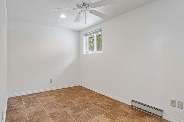 empty room with a textured ceiling, a baseboard radiator, and ceiling fan