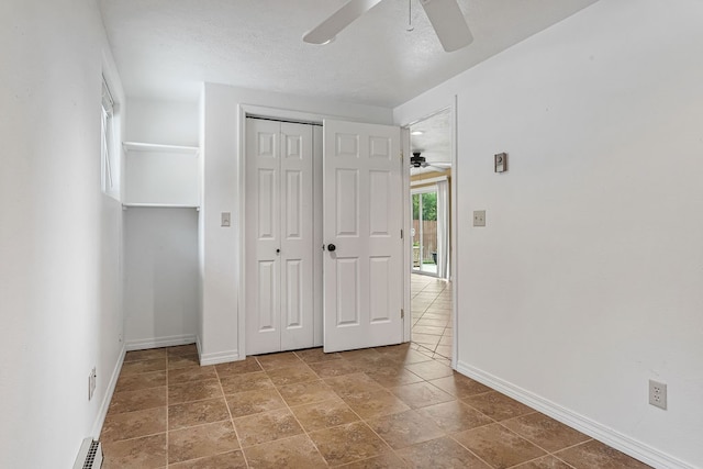 unfurnished bedroom featuring a closet and ceiling fan