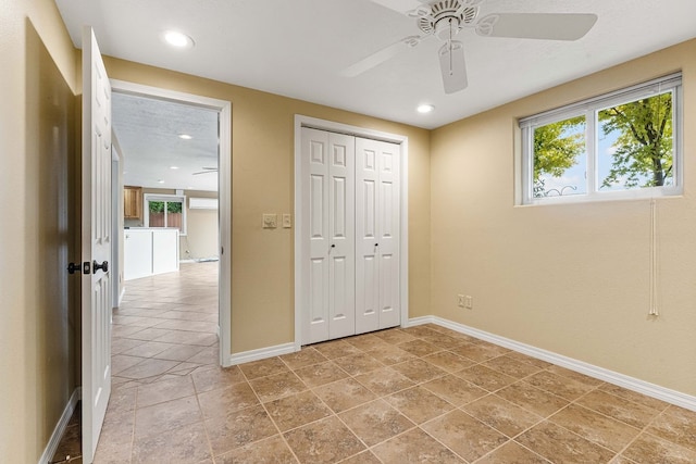 unfurnished bedroom featuring a closet and ceiling fan