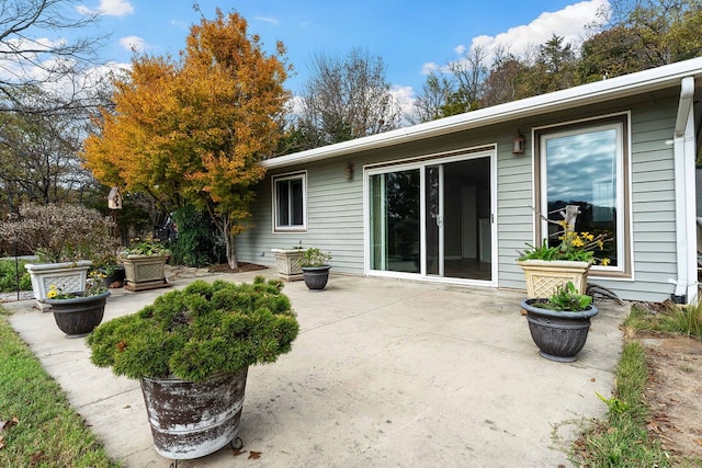 back of property featuring a patio area