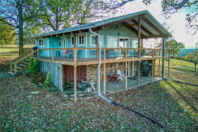 rear view of house with a patio area and a deck