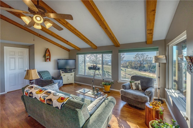 living room with hardwood / wood-style flooring, ceiling fan, and lofted ceiling with beams