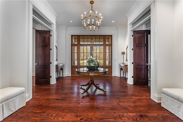 hallway featuring dark hardwood / wood-style floors, a chandelier, french doors, and ornamental molding