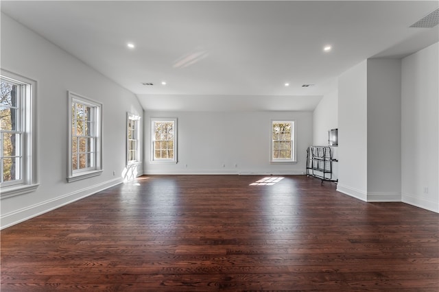 unfurnished living room with dark hardwood / wood-style flooring and vaulted ceiling