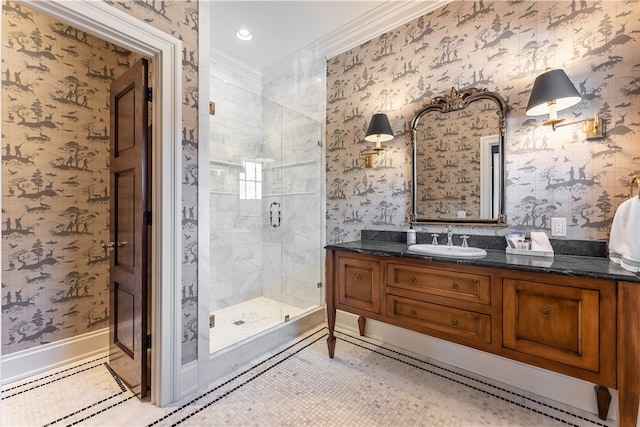 bathroom featuring vanity, an enclosed shower, tile patterned floors, and crown molding