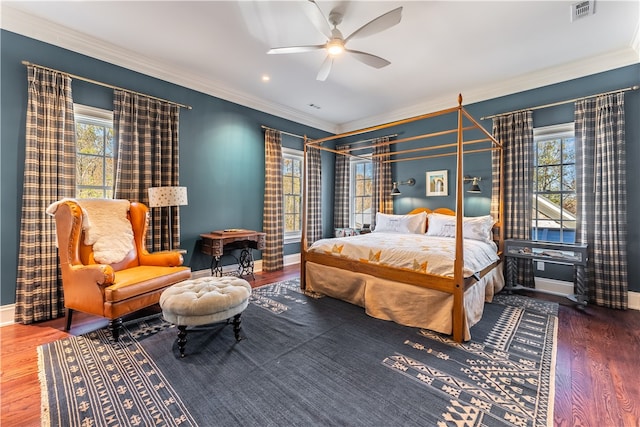 bedroom featuring ceiling fan, wood-type flooring, and crown molding