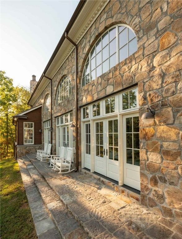 back of house featuring a patio and french doors