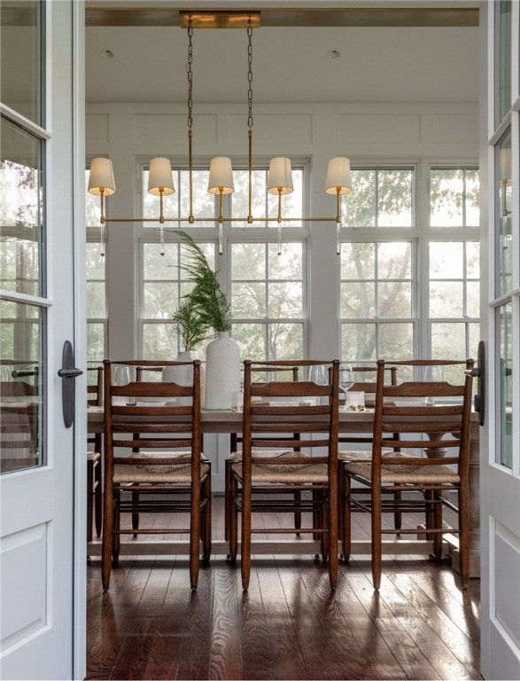 dining room with dark hardwood / wood-style flooring