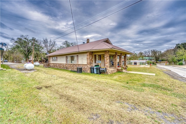 back of property with a lawn