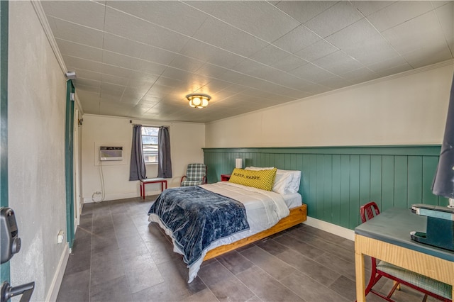 bedroom with crown molding and a wall mounted air conditioner