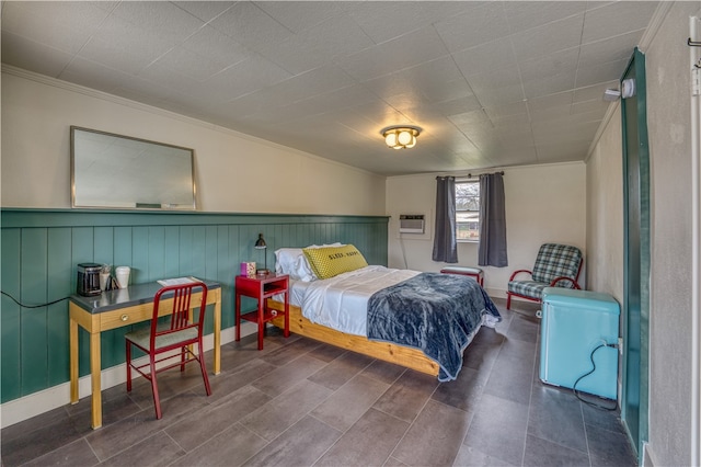 bedroom featuring crown molding and a wall mounted air conditioner