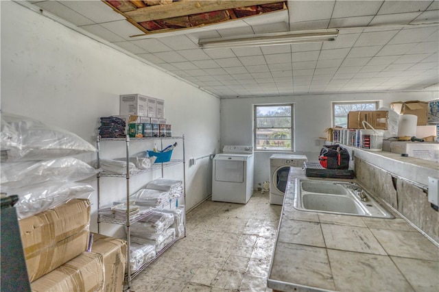 laundry room with sink and washer and clothes dryer