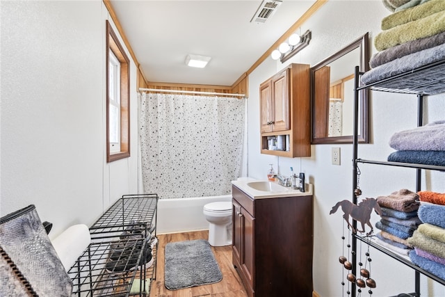 full bathroom featuring vanity, shower / bath combination with curtain, toilet, and wood-type flooring