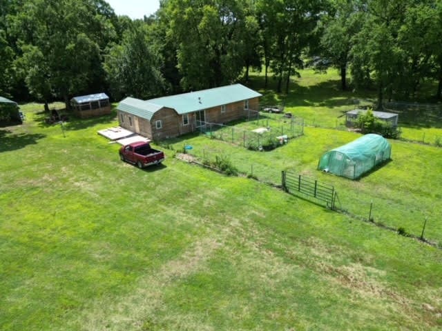 birds eye view of property with a rural view