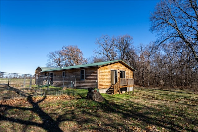 exterior space featuring a lawn