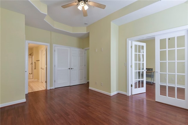 180 Grace Chapel Unit 107, Blue Eye, MO 65611 - unfurnished bedroom with dark hardwood / wood-style flooring, french doors, ceiling fan, and ensuite bathroom