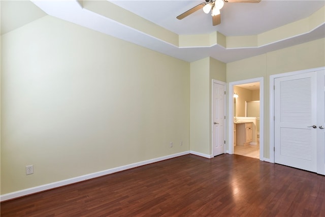 180 Grace Chapel Unit 107, Blue Eye, MO 65611 - unfurnished bedroom with hardwood / wood-style floors, ensuite bathroom, ceiling fan, and a tray ceiling