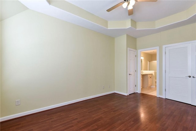 180 Grace Chapel Unit 107, Blue Eye, MO 65611 - unfurnished bedroom featuring wood finished floors, baseboards, connected bathroom, and ceiling fan