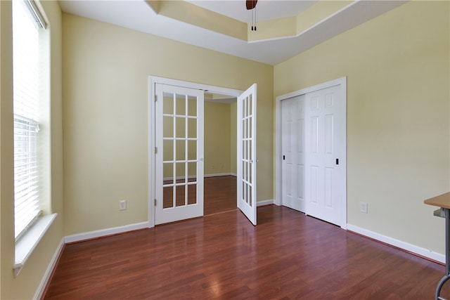 180 Grace Chapel Unit 107, Blue Eye, MO 65611 - empty room featuring french doors, dark hardwood / wood-style flooring, ceiling fan, and a tray ceiling