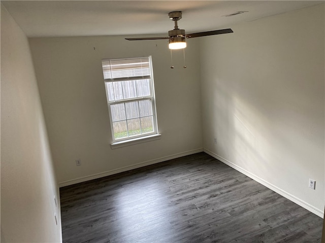 unfurnished room with dark hardwood / wood-style flooring, lofted ceiling, and ceiling fan