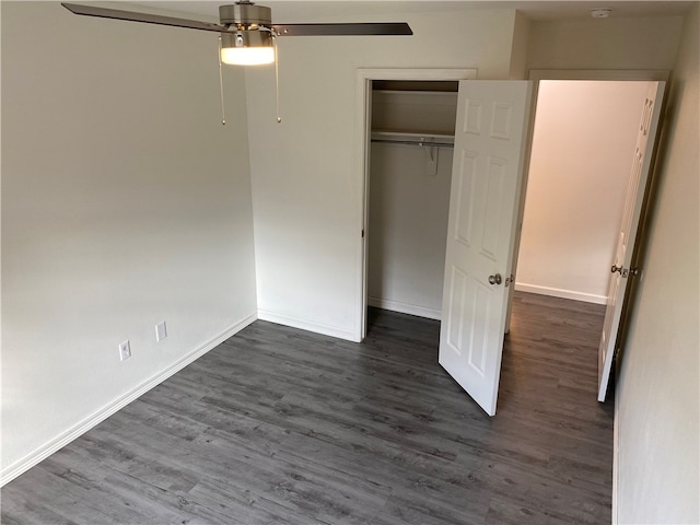 unfurnished bedroom with ceiling fan, dark hardwood / wood-style floors, and a closet