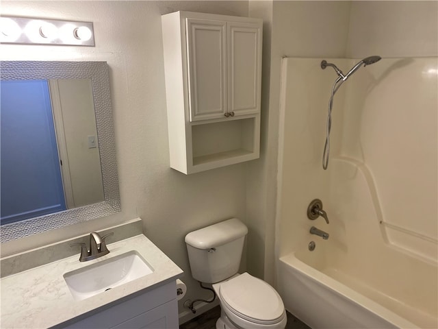 full bathroom with toilet, vanity, and  shower combination